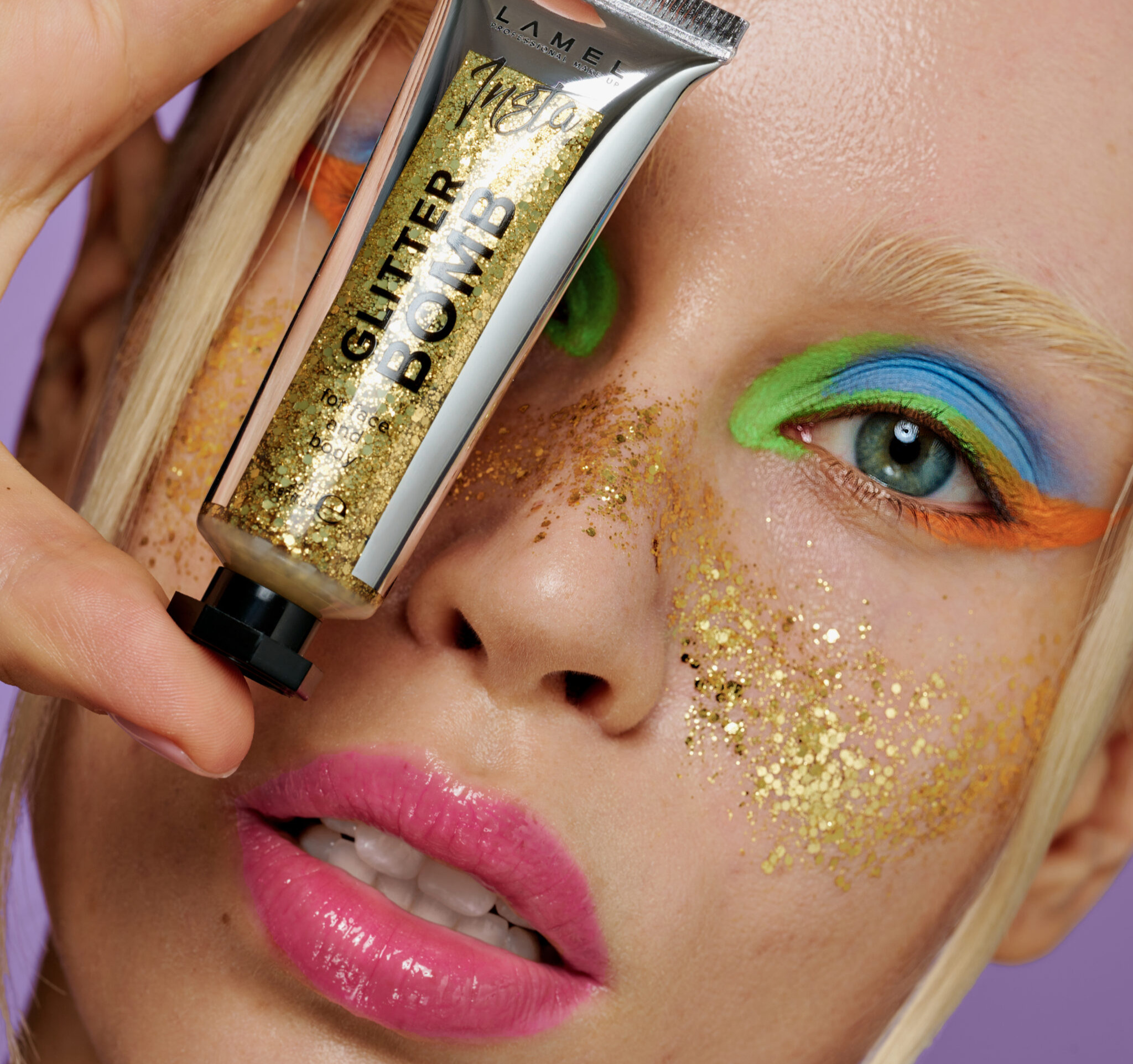 Model with glitter make-up holding LAMEL Glitter Bomb
