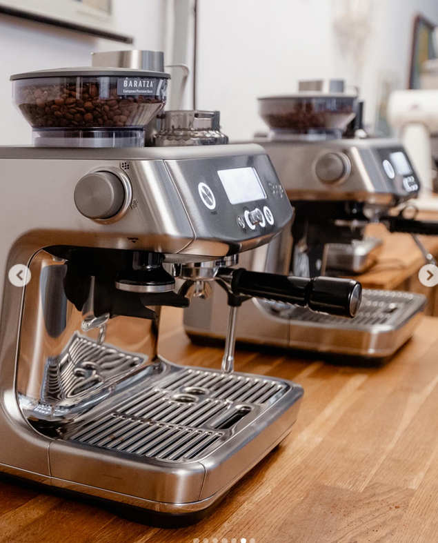 Sage coffee machines displayed on a wooden counter