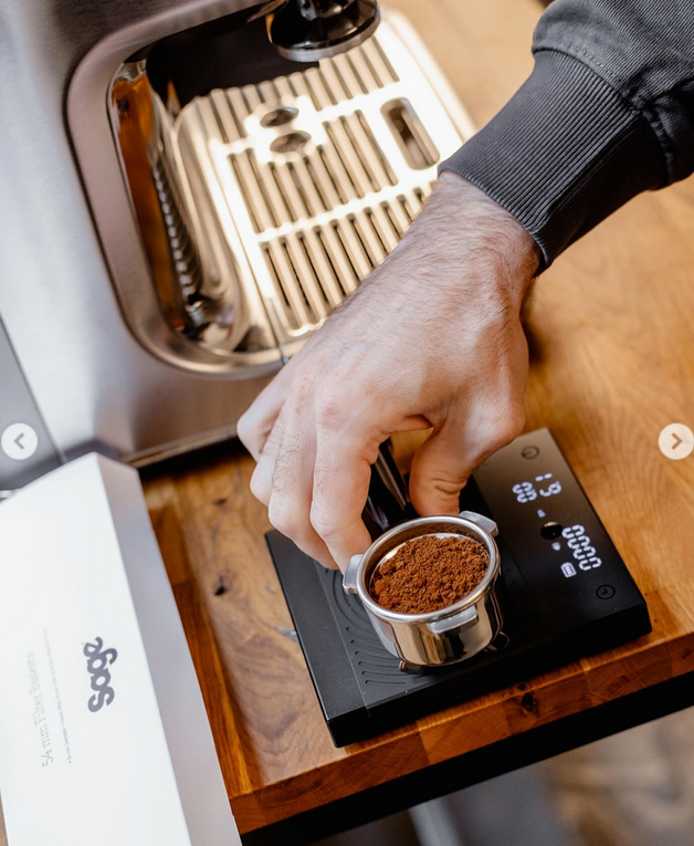 Weighing ground coffee during a Sage demonstration